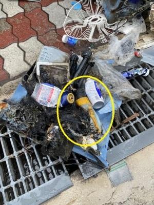 火元のコードレス工具とスプレー缶が燃えた後の写真