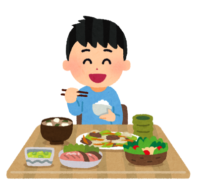 味噌汁、色とりどりのおかずが並べられたテーブルについてお茶碗を持って食事をしている笑顔の男の子のイラスト